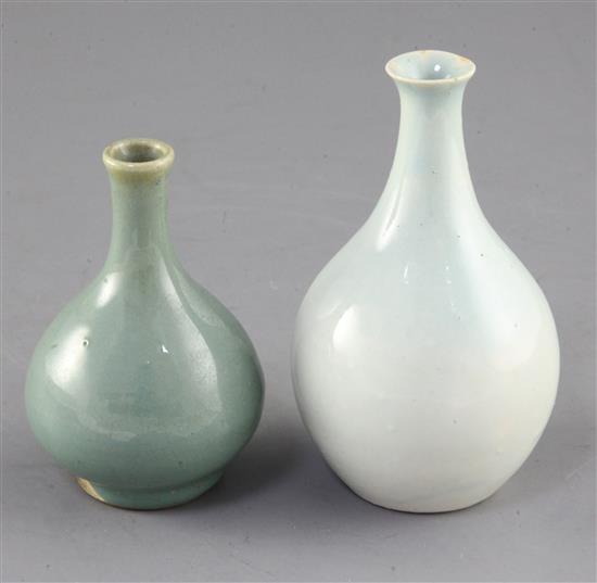 A Chinese Qingbai style bottle vase and a small Jun type green glazed bottle vase, possibly 17th / 18th century, height 11.7cm and 9.7